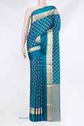 Peacock Blue Mysore Crepe Saree with Zari Butta on the body and Zari Border.  displayed on a mannequin