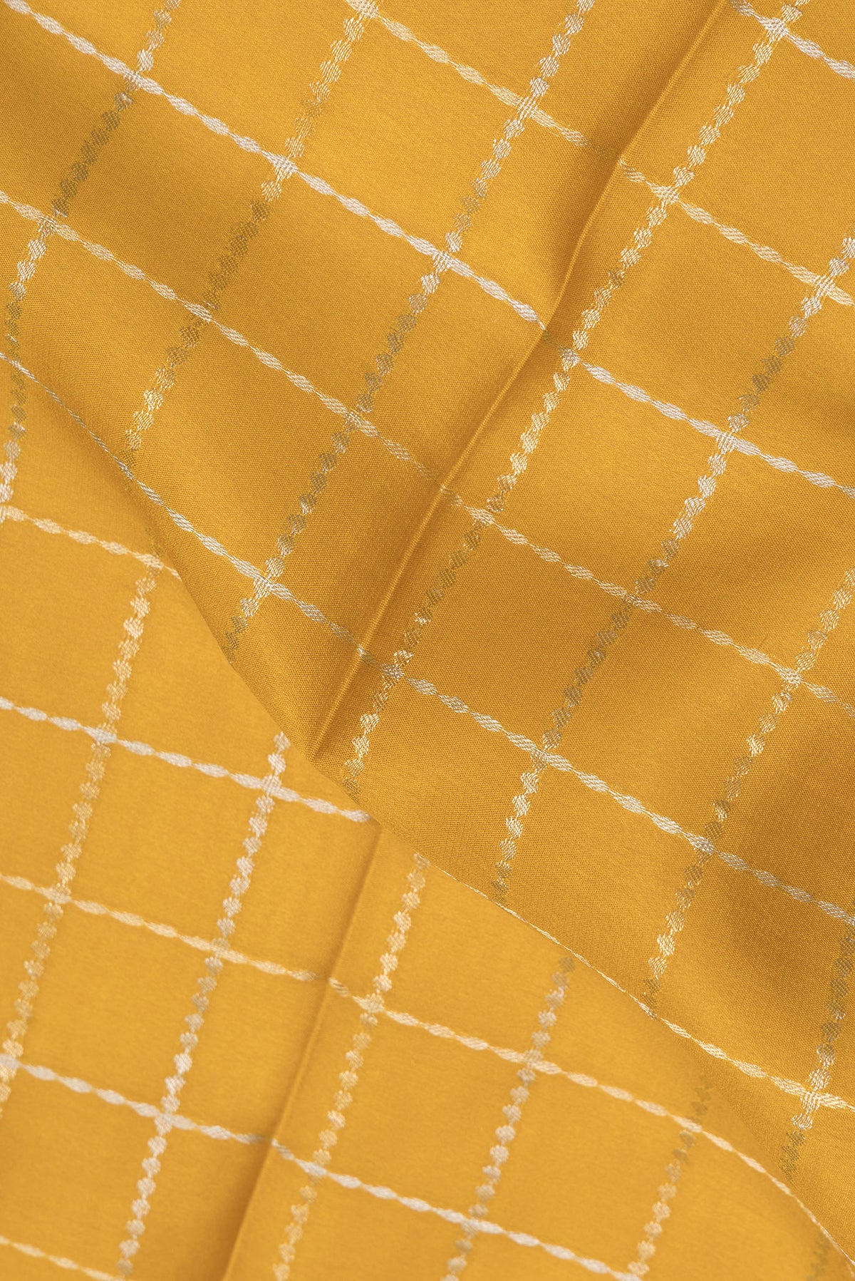 Close up of Mustard Dual Tone Georgette Saree with Checked design on the body and Plain Border.  displaying folds