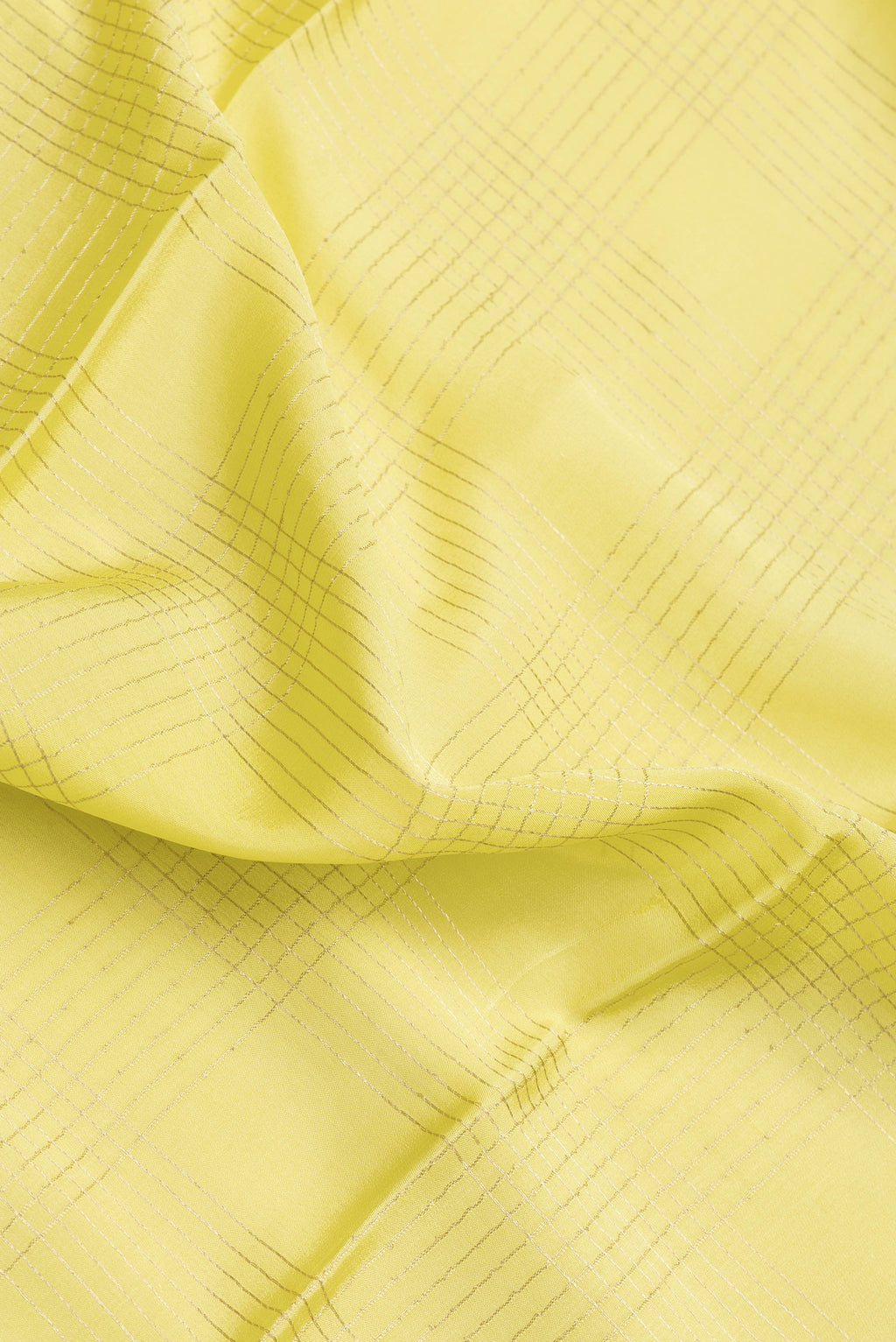 Close up of Pista Green Dual Tone Mysore Silk Saree with Checked design on the body and Zari And Thread Border.  displaying folds