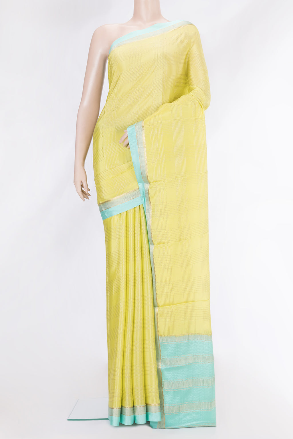 Pista Green Dual Tone Mysore Silk Saree with Checked design on the body and Zari And Thread Border.  displayed on a mannequin
