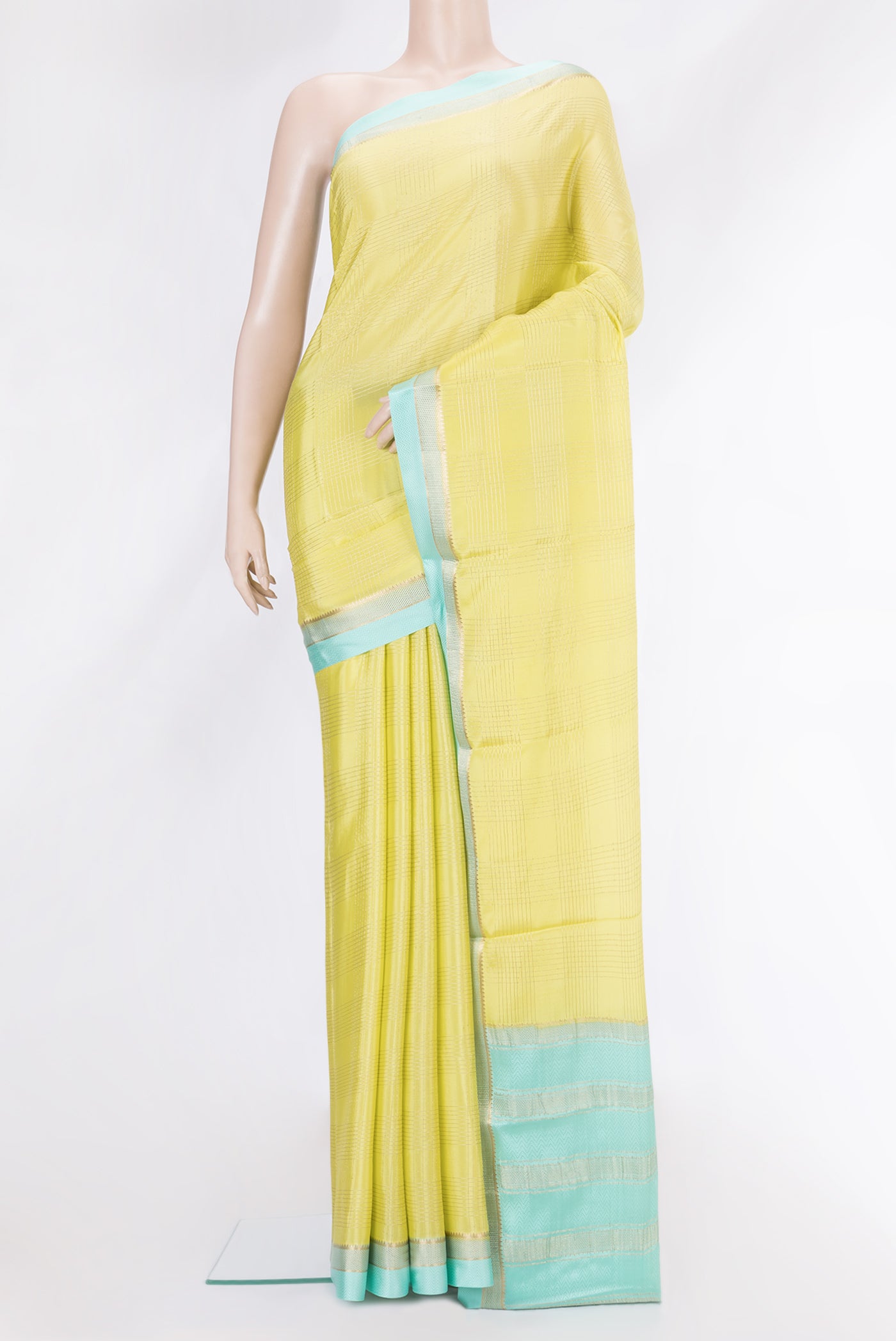 Pista Green Dual Tone Mysore Silk Saree with Checked design on the body and Zari And Thread Border.  displayed on a mannequin