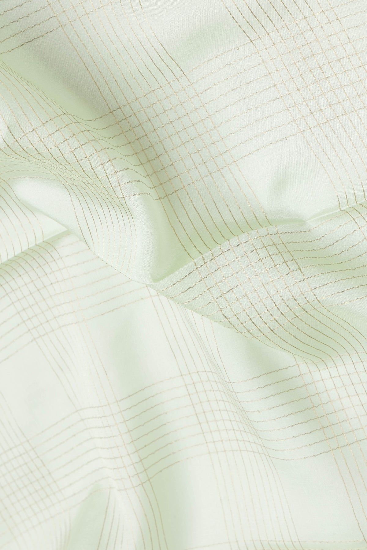 Close up of Pista Green Dual Tone Mysore Silk Saree with Checked design on the body and Zari And Thread Border.  displaying folds