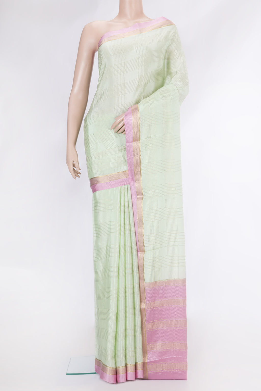 Pista Green Dual Tone Mysore Silk Saree with Checked design on the body and Zari And Thread Border.  displayed on a mannequin