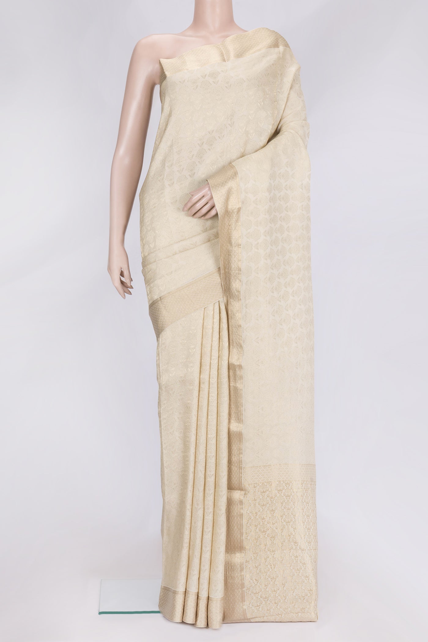 Beige Dual Tone Mysore Georgette Saree with Zari Brocade on the body and Zari Border.  displayed on a mannequin