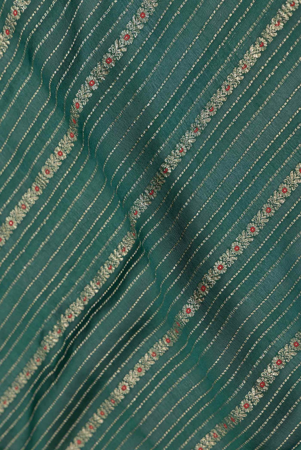 Close up of Green Dual Tone Mysore Georgette Saree with Zari Brocade on the body and Zari Border displaying folds