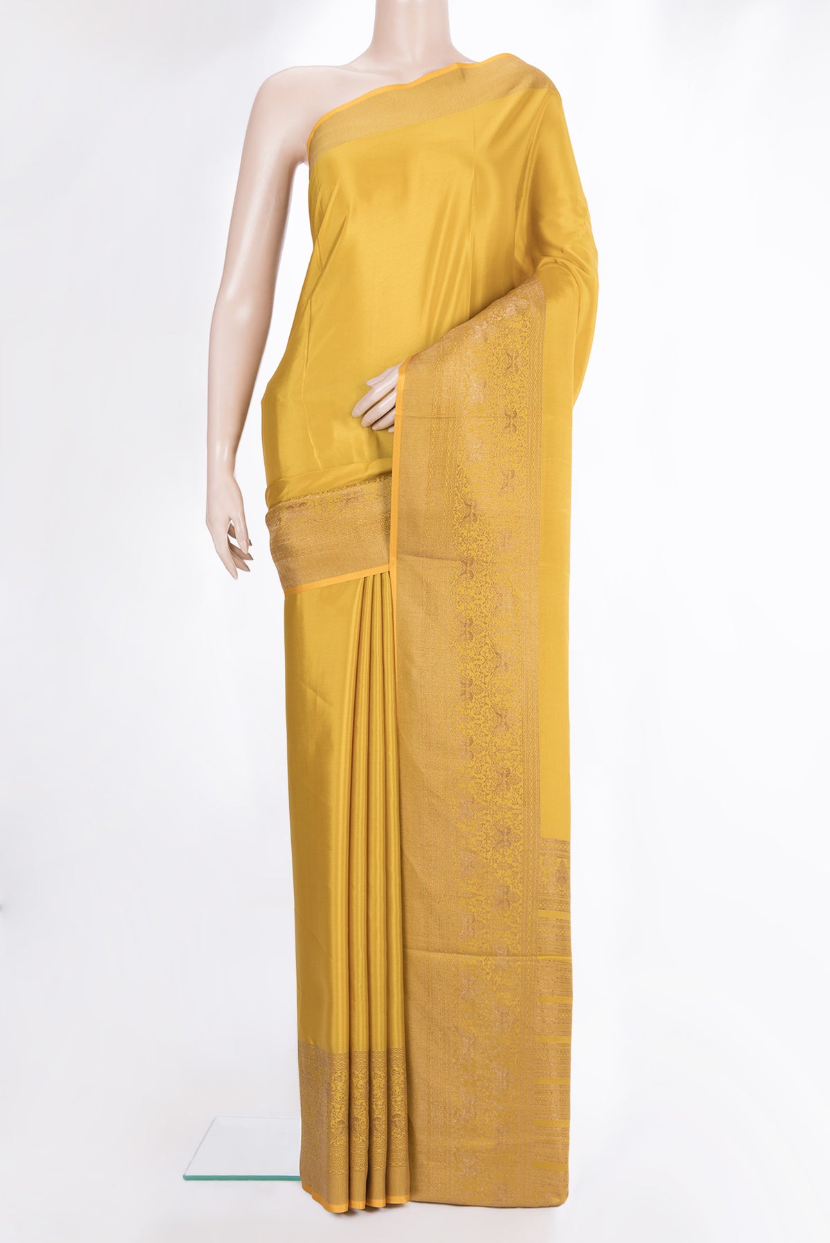 Mustard Mysore Crepe Saree with Plain Body and Fancy Border.  displayed on a mannequin