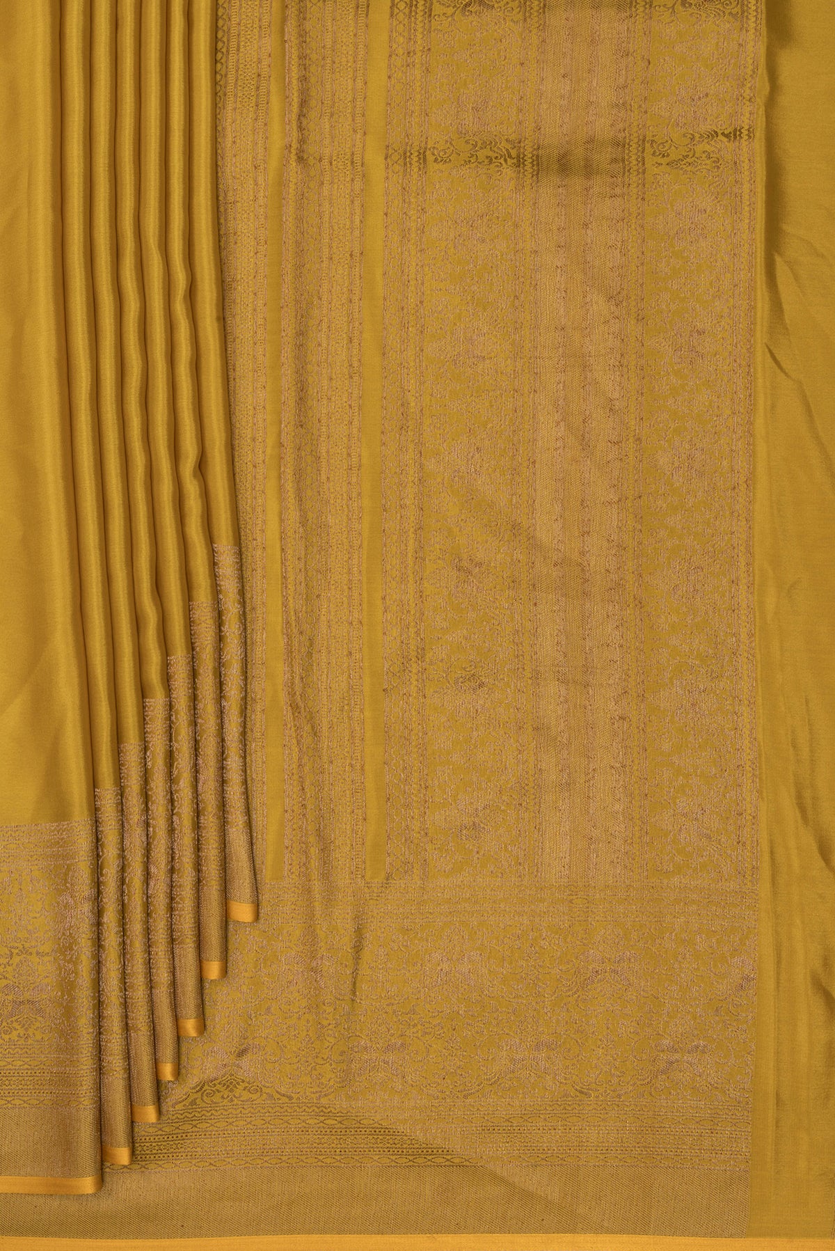 Pleats and pallu of Mustard Mysore Crepe Saree with Plain Body and Fancy Border. 