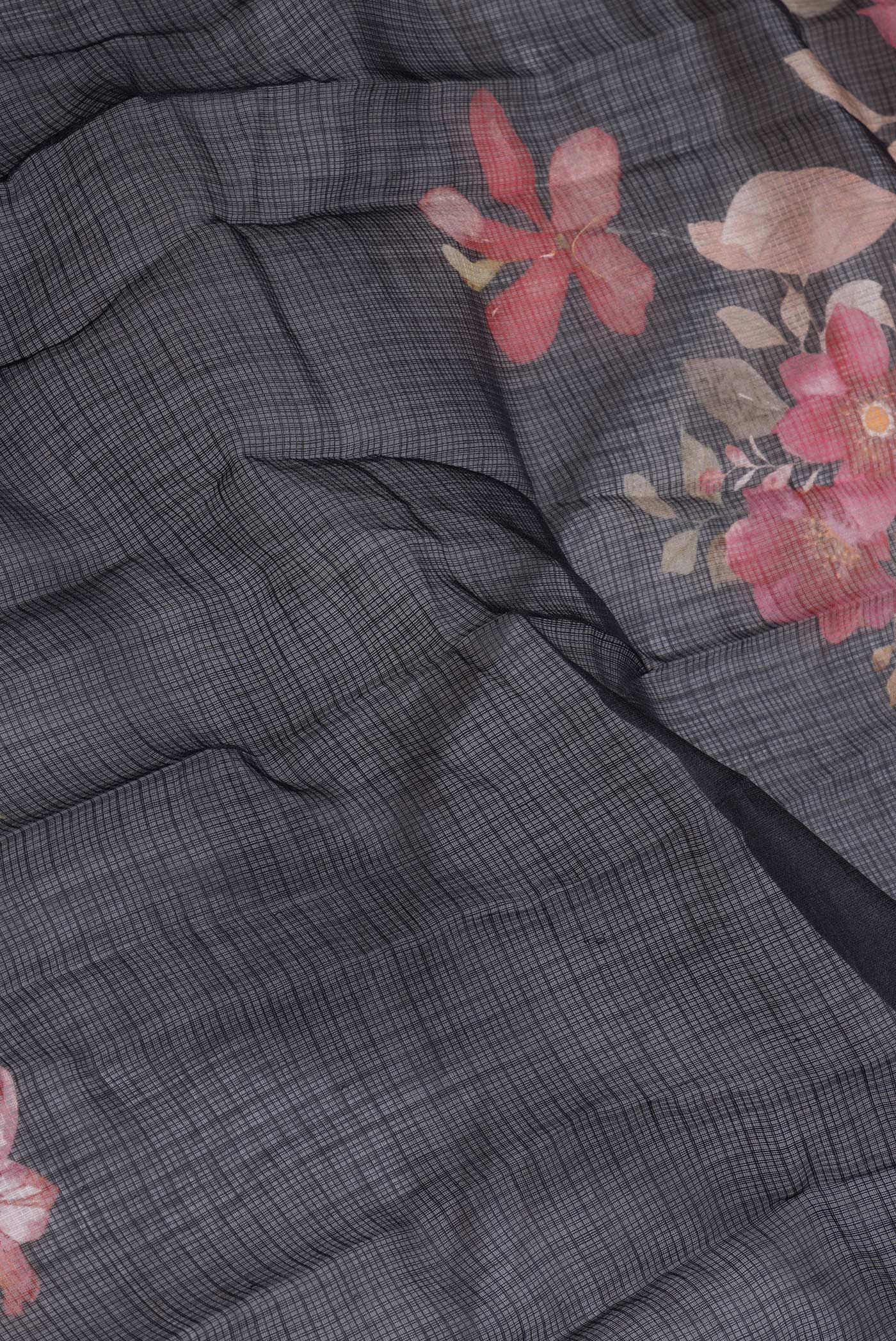 Close up of Black Dual Tone Kota Silk Saree with Printed design on the body and Thread Border.  displaying folds