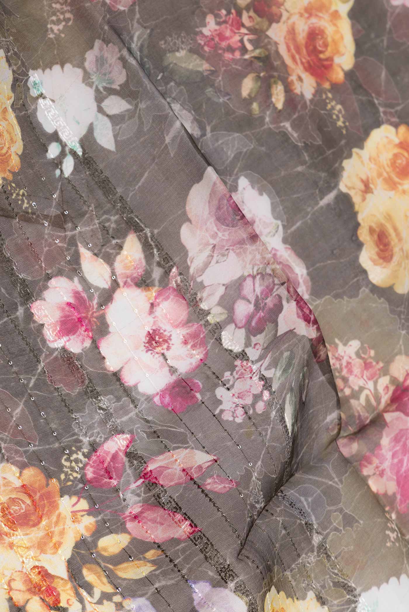 Close up of Brown Organza Silk Saree with Embroidery on the body and Embroidery Border displaying folds