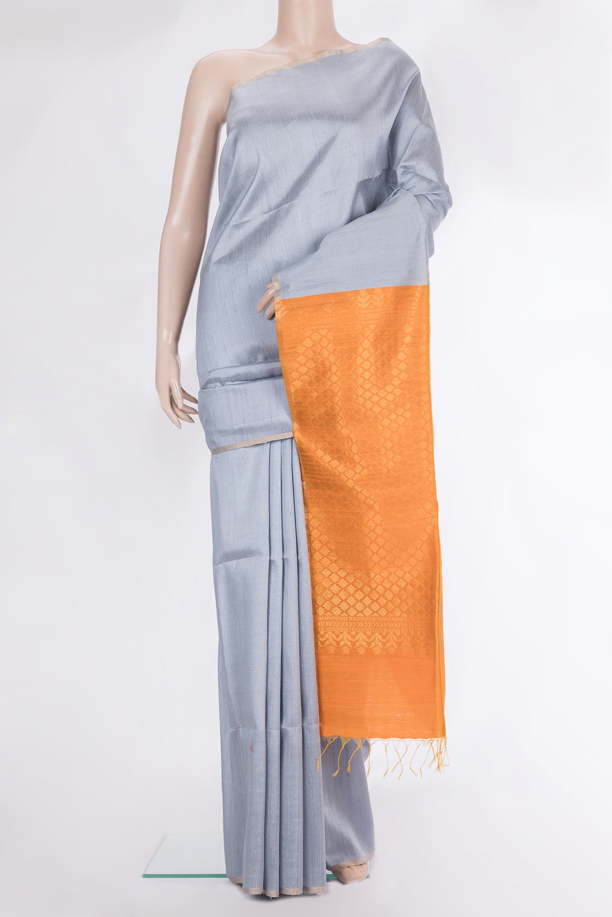 Grey Raw Saree with Plain Body and Zari Border.  displayed on a mannequin