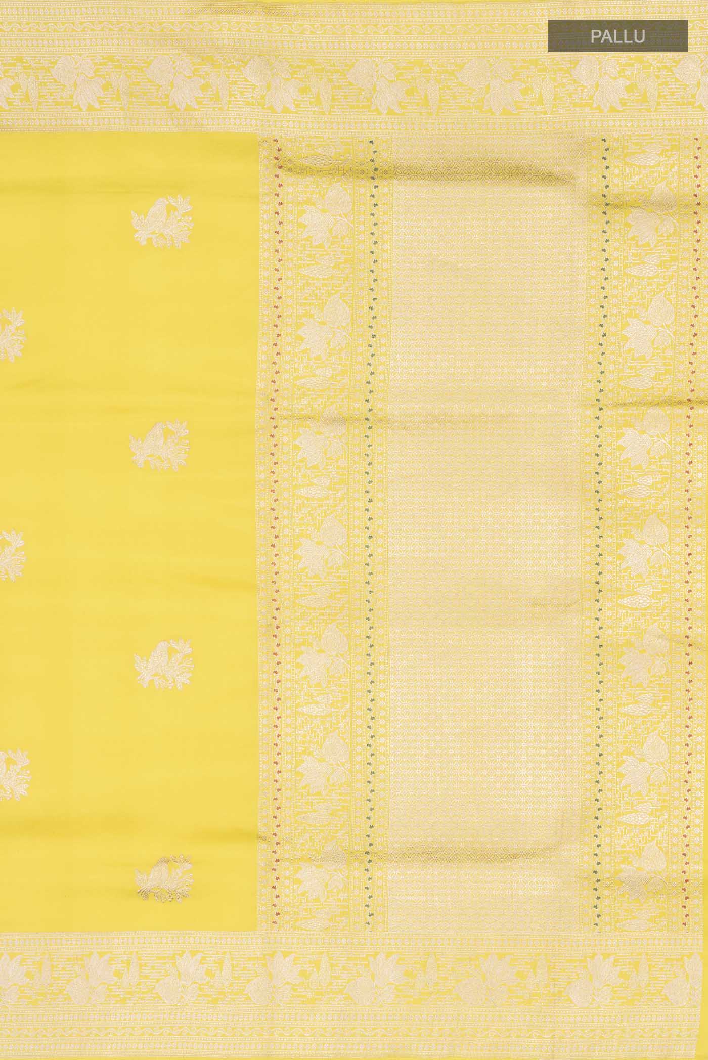Close up image of the pallu of Yellow Banarasi Silk Saree with Zari Butta on the body and Zari Border