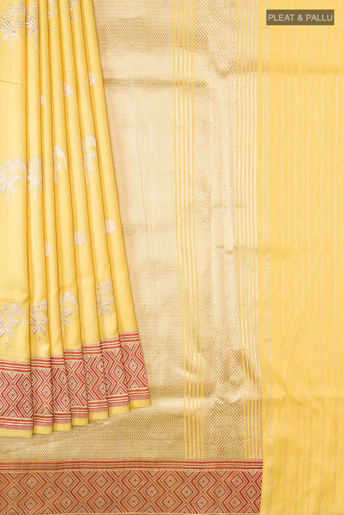 Pleats and pallu of Yellow Banarasi Silk Saree with Zari Butta on the body and Zari Border