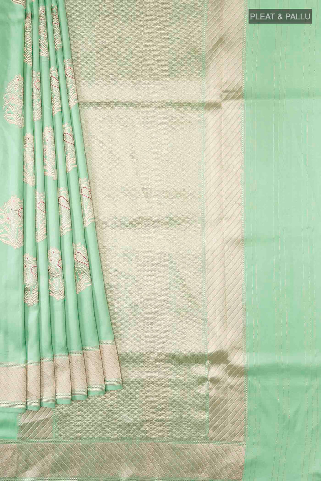 Pleats and pallu of Green Banarasi Silk Saree with Zari Butta on the body and Zari Border
