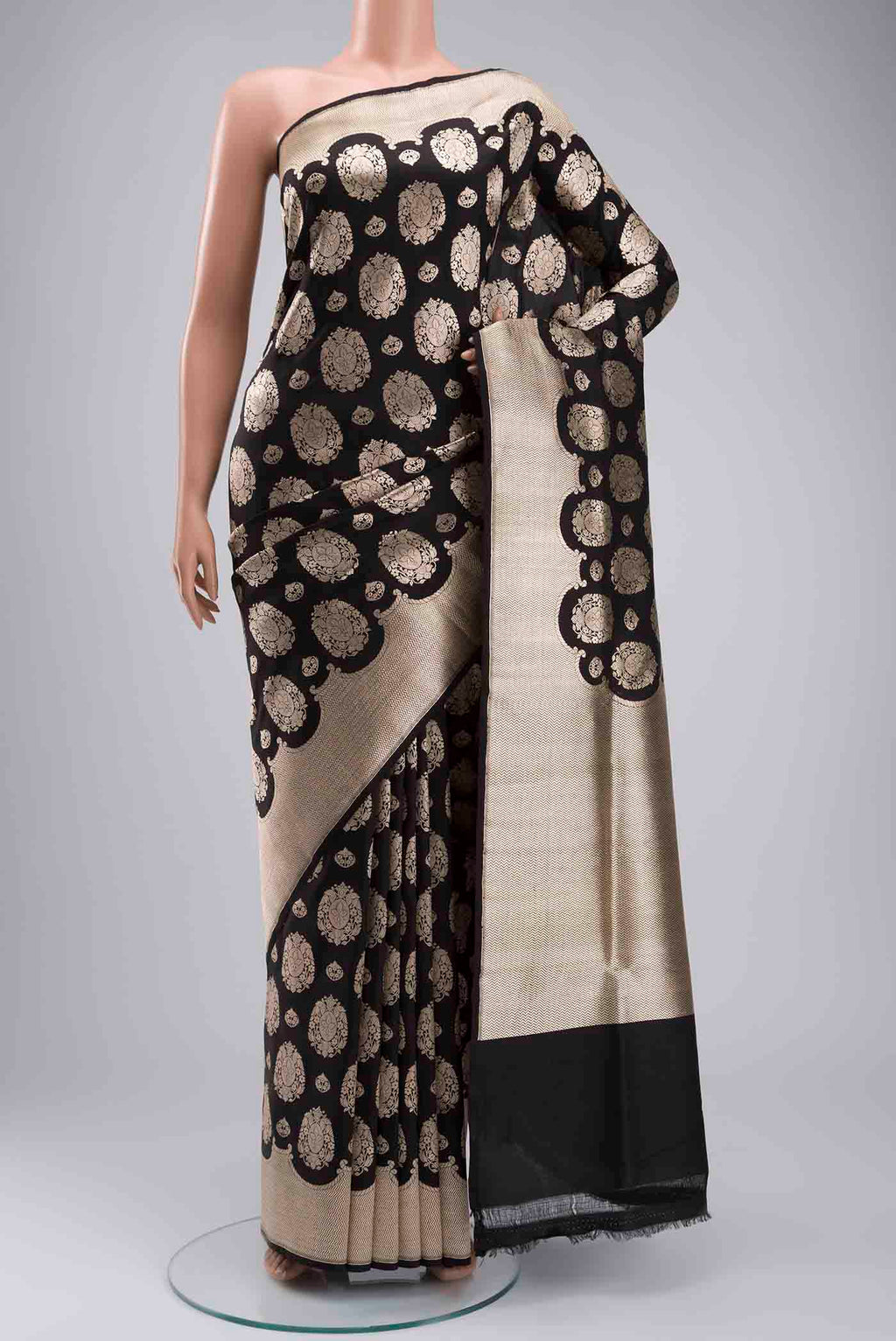 Black Banarasi Silk Saree with Zari Butta on the body and Zari Border displayed on a mannequin