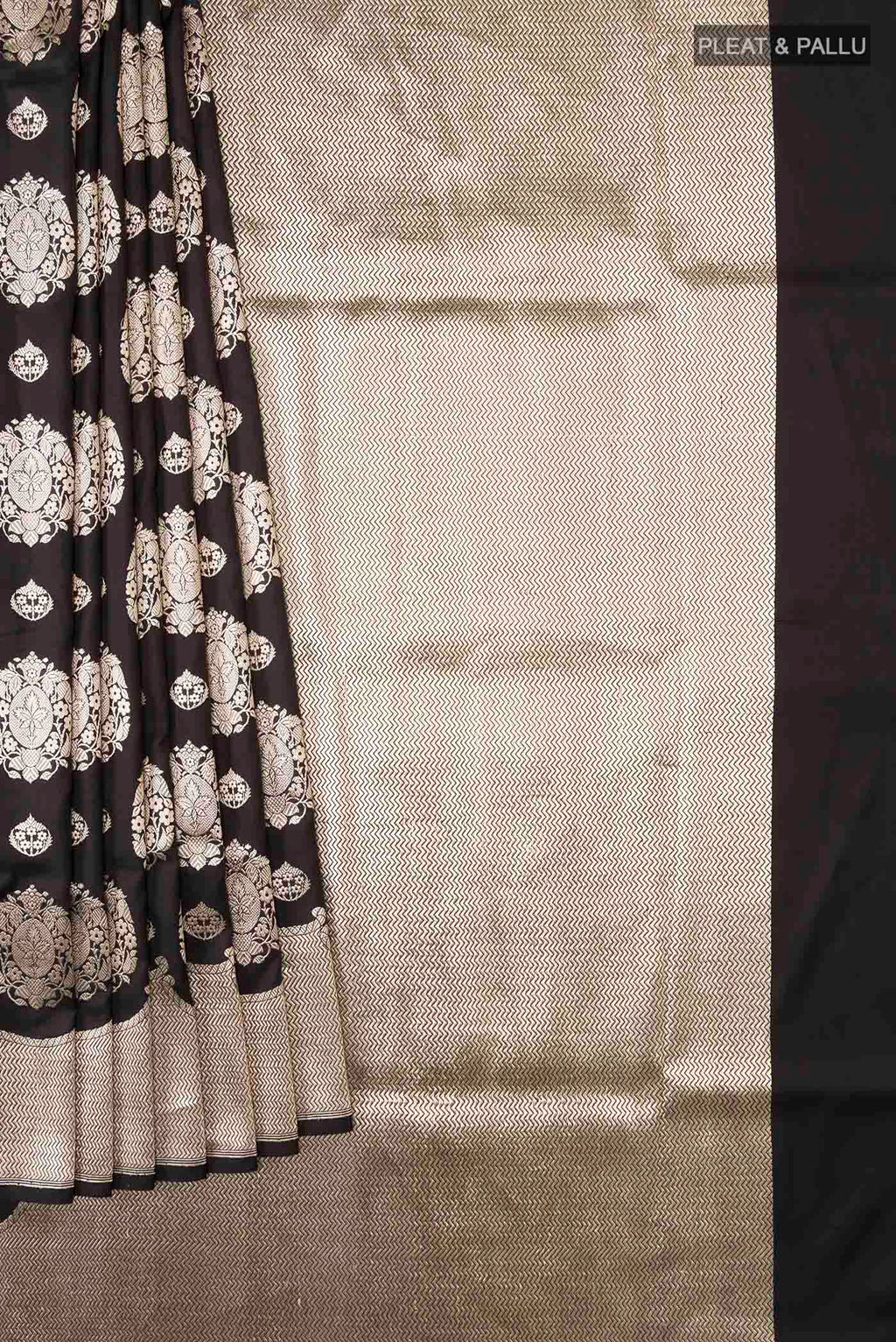 Pleats and pallu of Black Banarasi Silk Saree with Zari Butta on the body and Zari Border