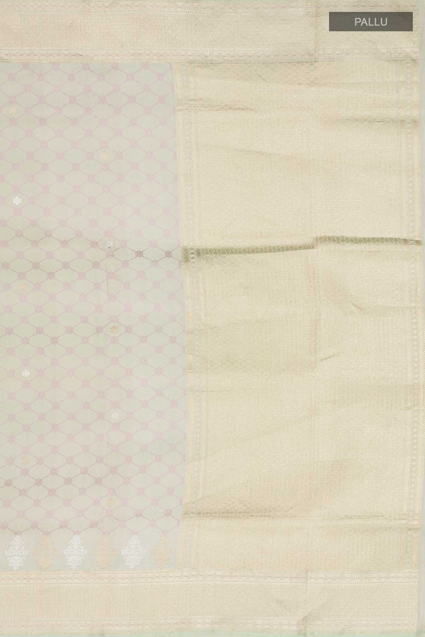Close up image of the pallu of Green Banarasi Silk Saree with Zari Butta on the body and Zari Border