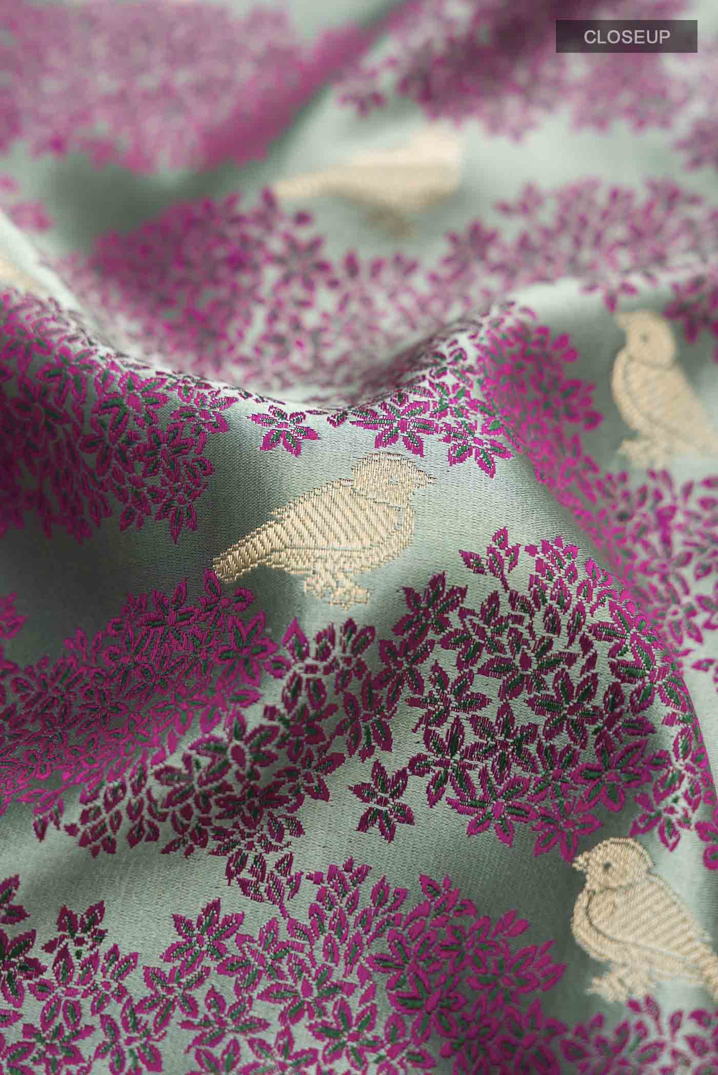 Close up of Sea Green Banarasi Silk Saree with Jacquard With Zari Butta on the body and Zari Border displaying folds