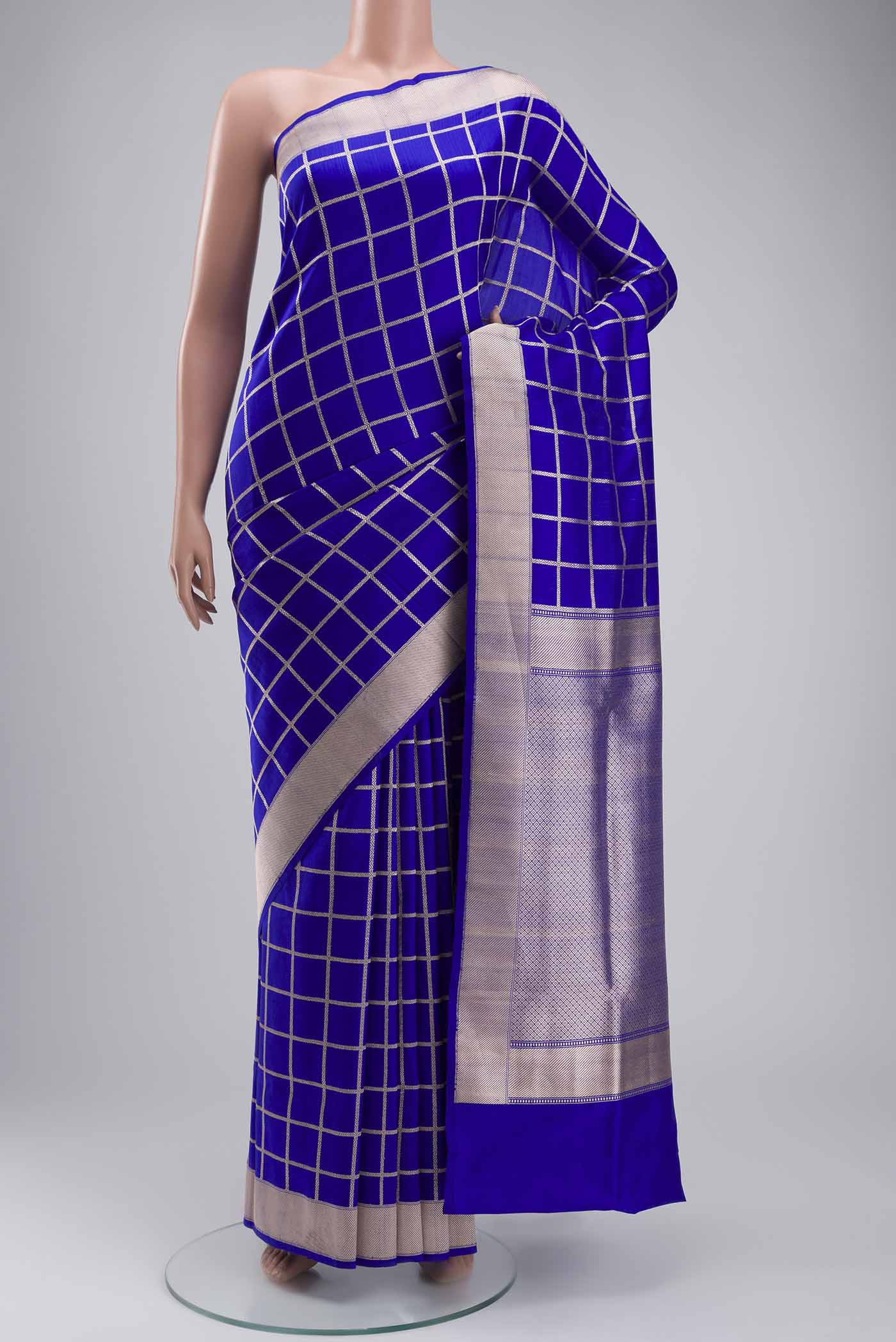 Royal Blue Banarasi Silk Saree with Checked design on the body and Zari Border displayed on a mannequin