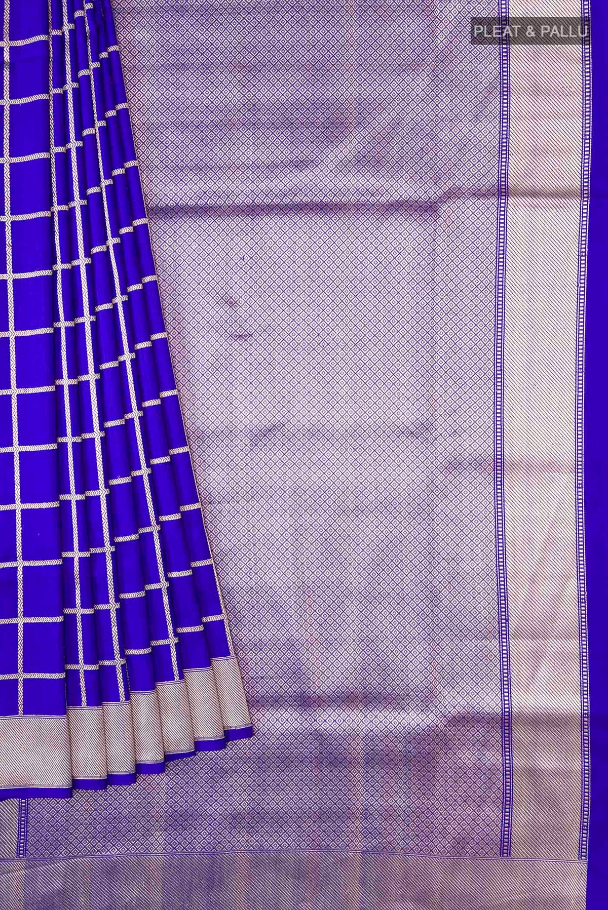 Pleats and pallu of Royal Blue Banarasi Silk Saree with Checked design on the body and Zari Border