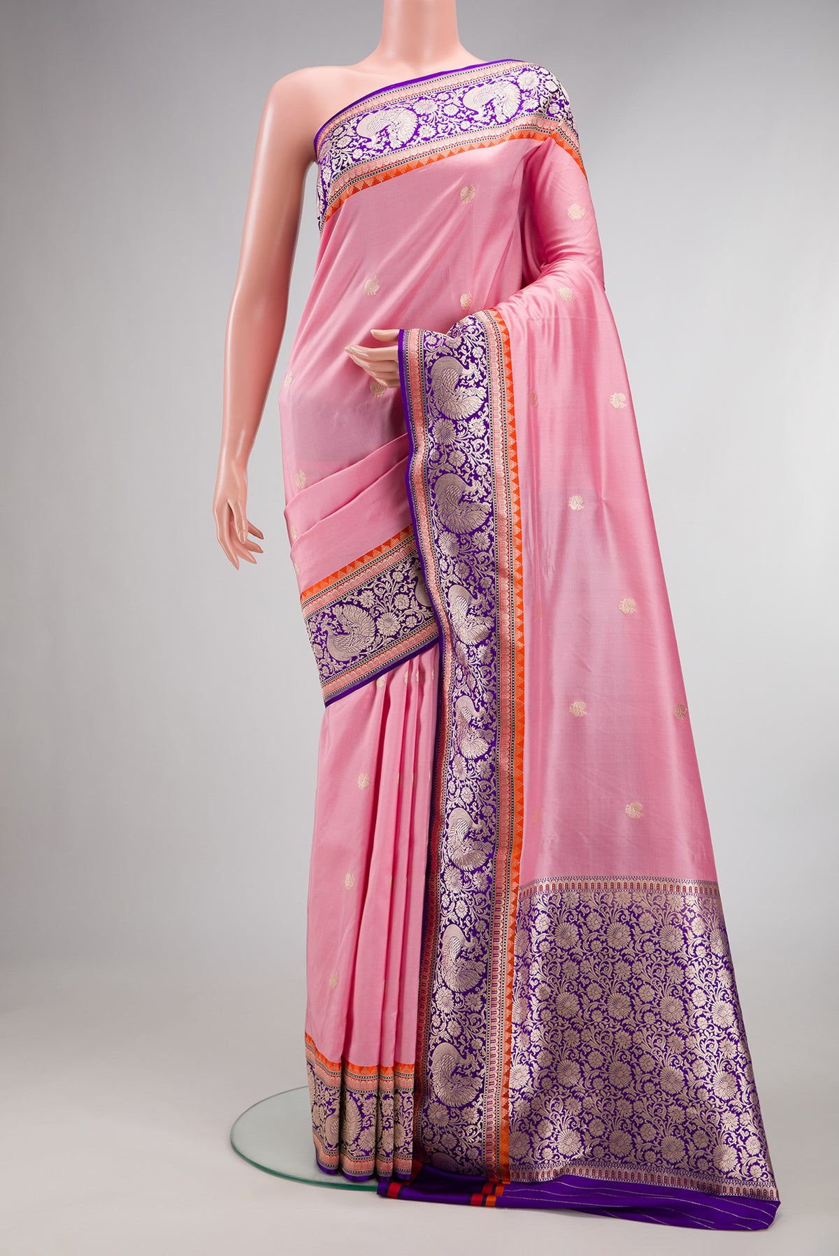 Pure Silk Rose pink Banarasi Saree with Zari Butta on the body and Fancy Border.  displayed on a mannequin
