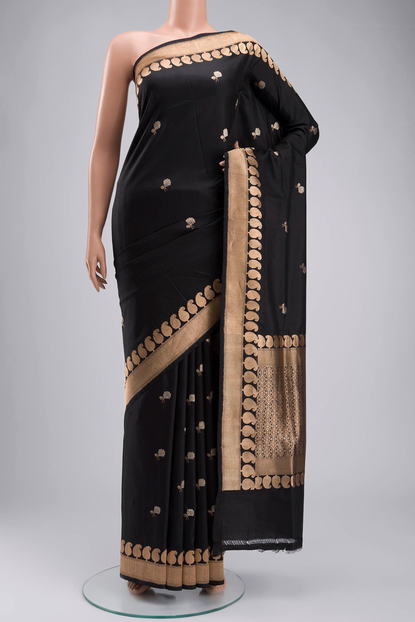 Black Banarasi Katan Silk Saree with Zari Butta on the body and Zari Border displayed on a mannequin