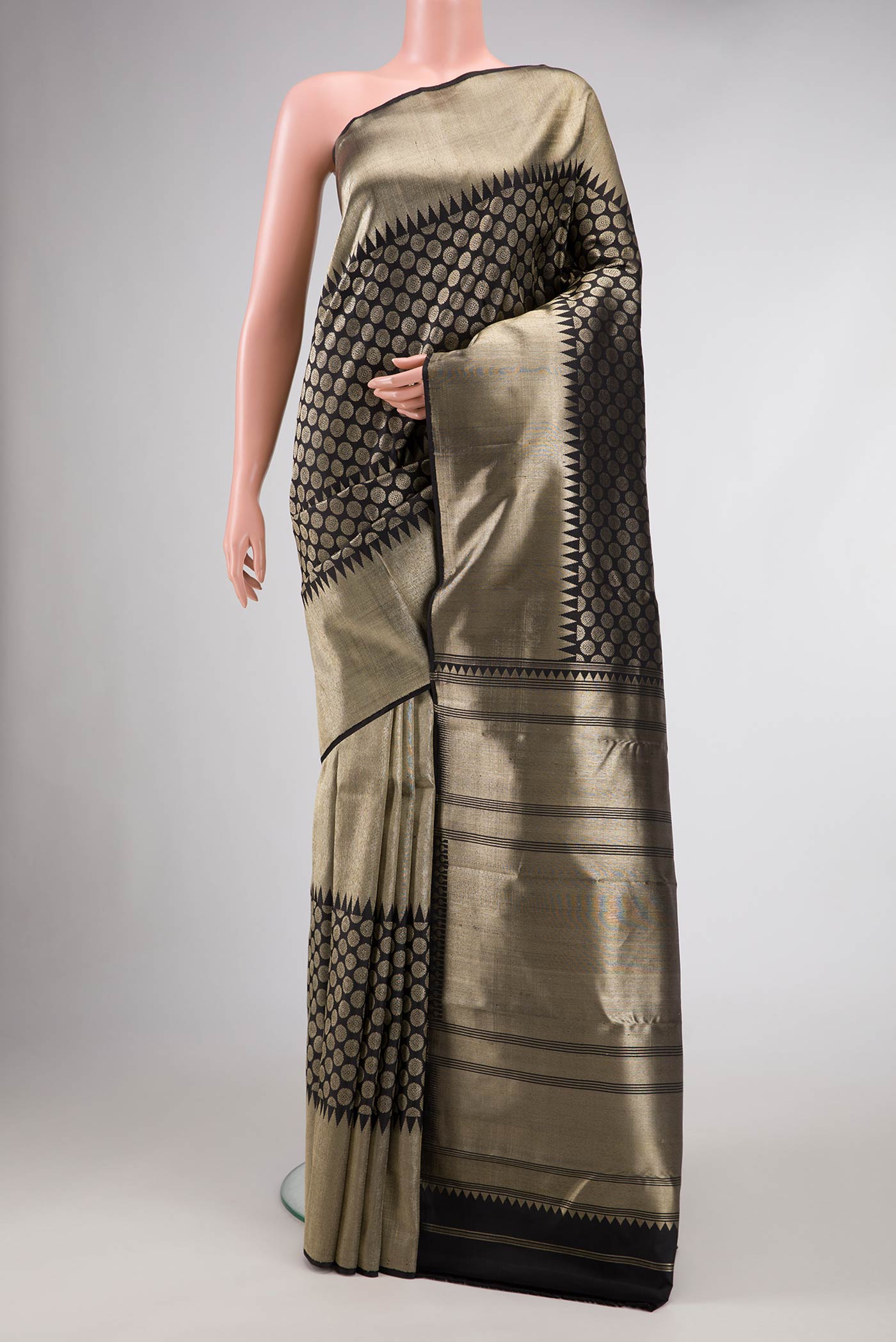 Black Dual Tone Kanchipuram Silk Saree with Zari Brocade on the body and Zari Border.  displayed on a mannequin