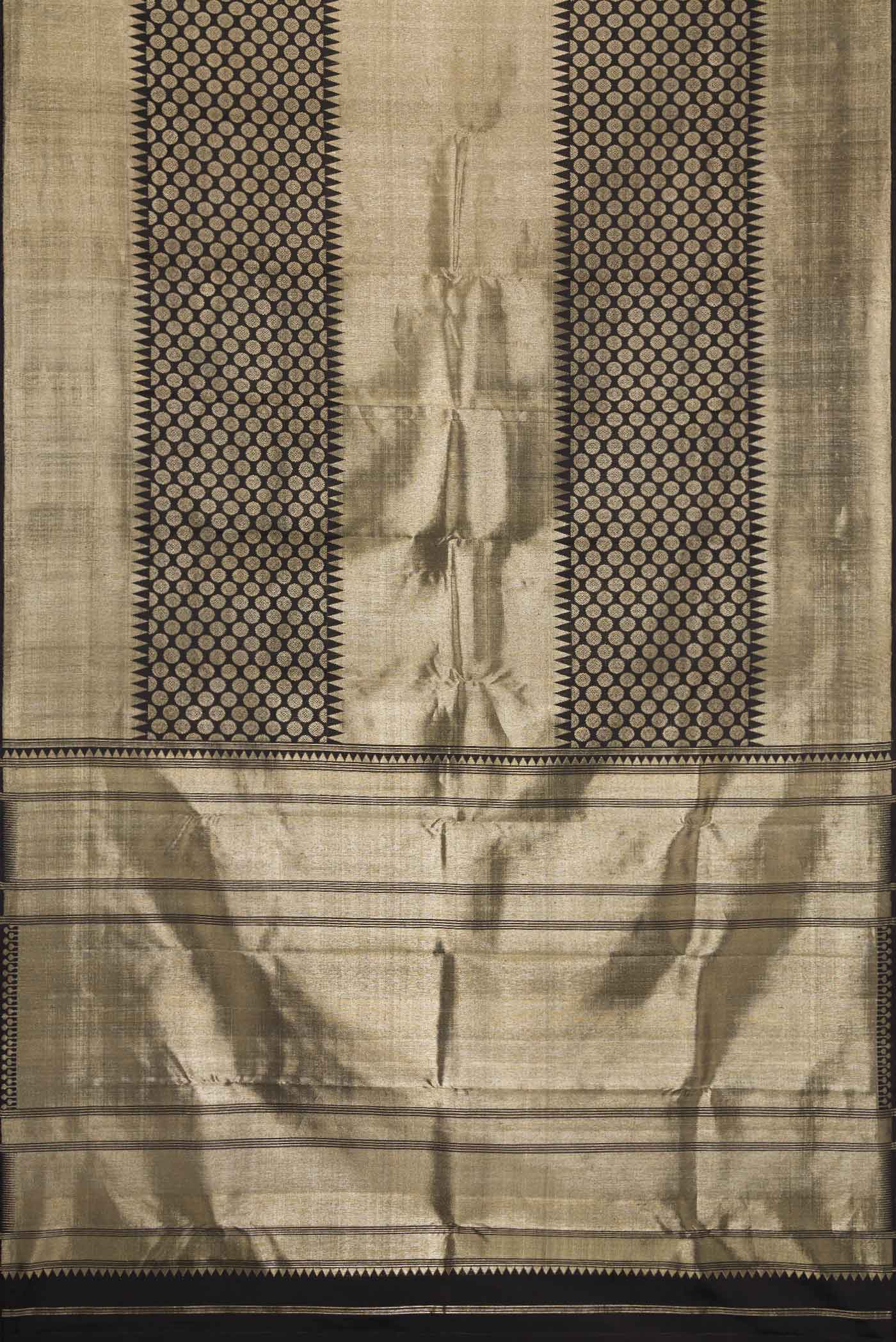 Flat view of Black Dual Tone Kanchipuram Silk Saree with Zari Brocade on the body and Zari Border. 