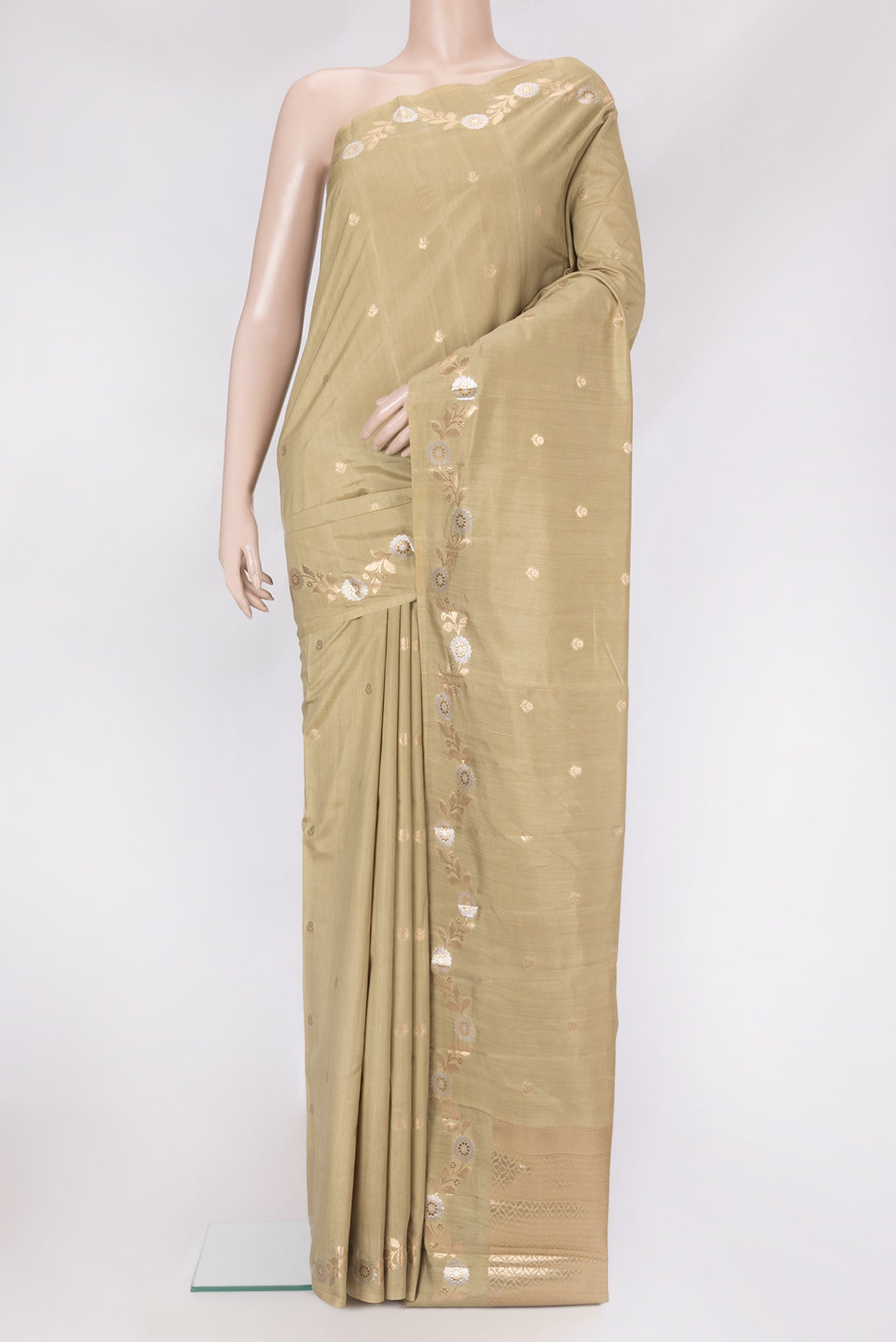 Beige Dual Tone Tussar Silk Saree with Zari Butta on the body and Fancy Border.  displayed on a mannequin