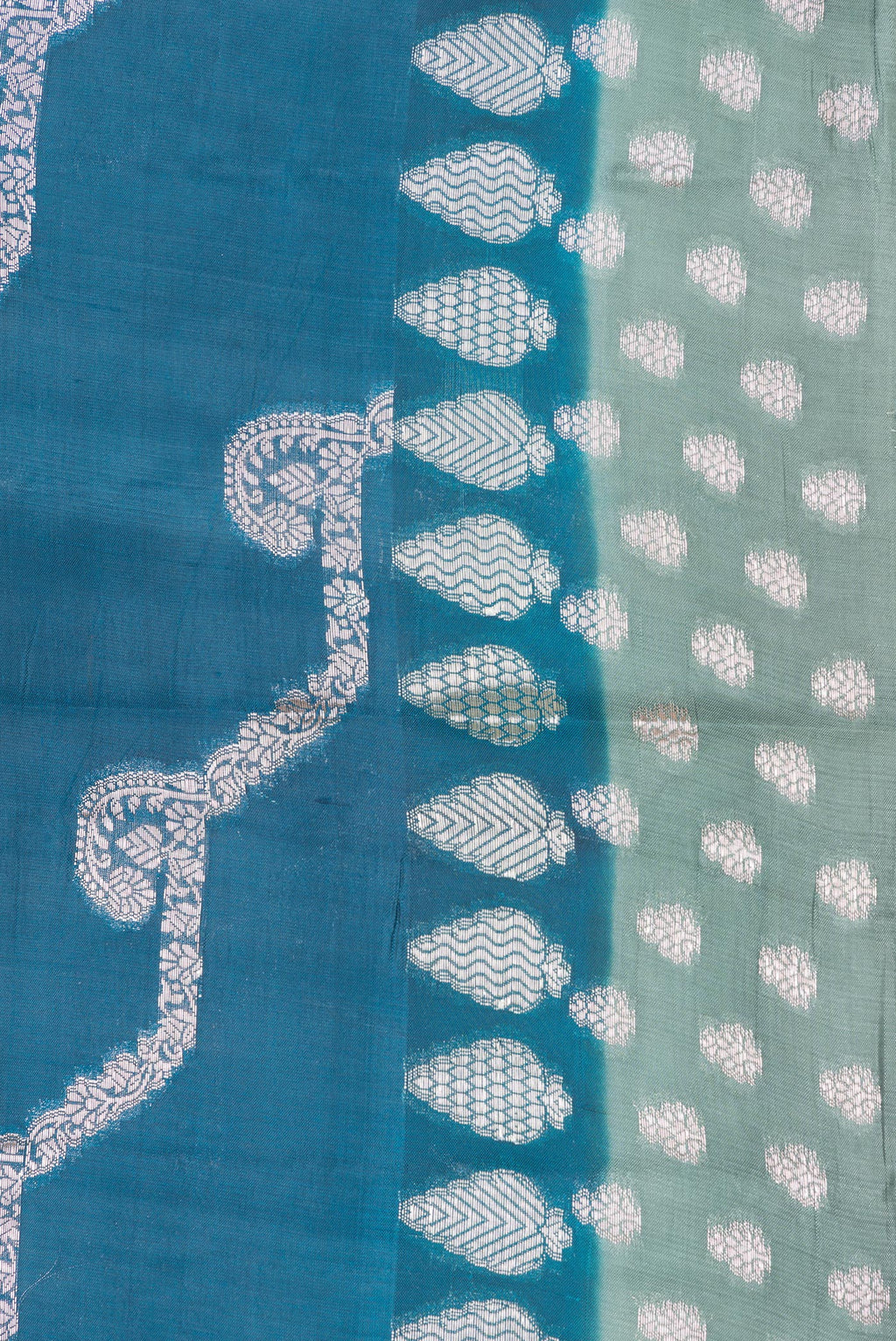 Border image of Peacock Blue Dual Tone Tussar Silk Saree with Zari Butta on the body and Fancy Border. 