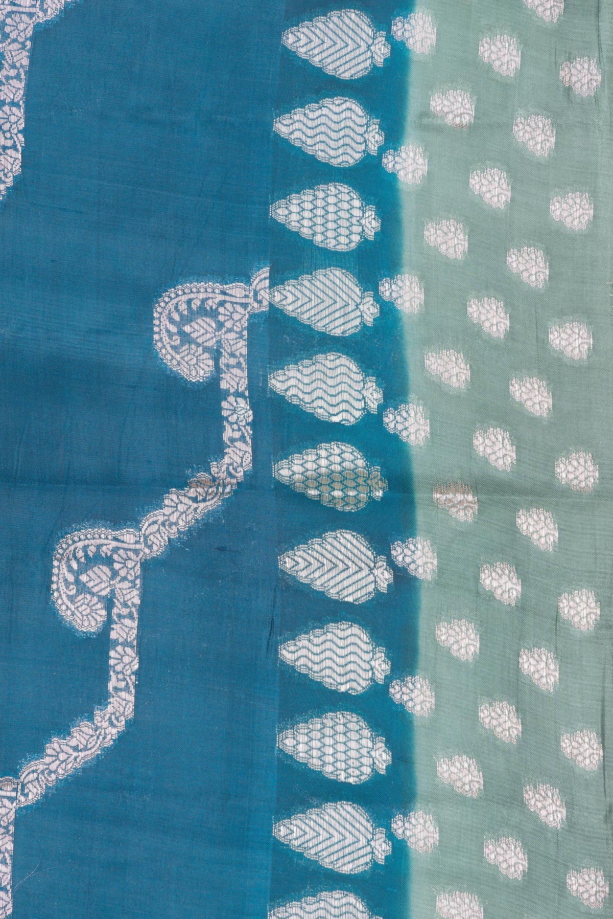 Border image of Peacock Blue Dual Tone Tussar Silk Saree with Zari Butta on the body and Fancy Border. 