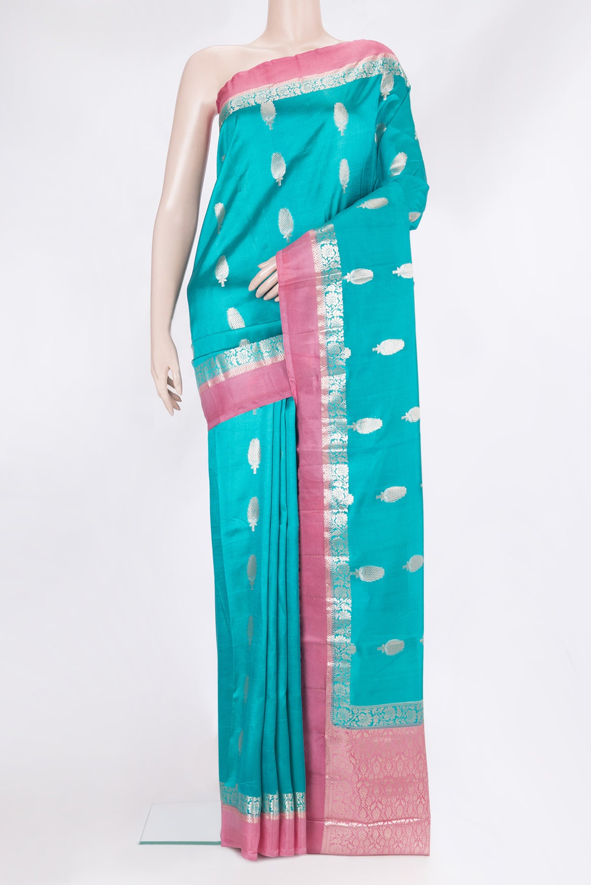 Sky Blue Tussar Silk Saree with Zari Butta on the body and Zari Border.  displayed on a mannequin