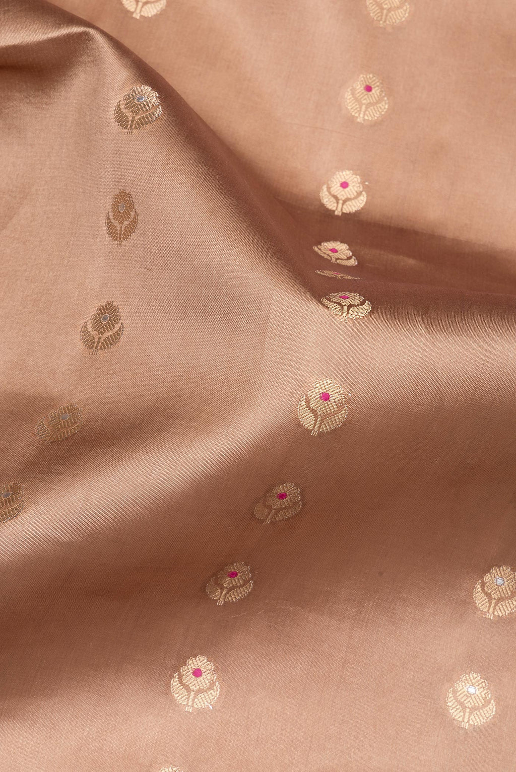 Close up of Pure Silk Bronze Dual Tone Tussar Saree with Zari Butta on the body and Fancy Border.  displaying folds