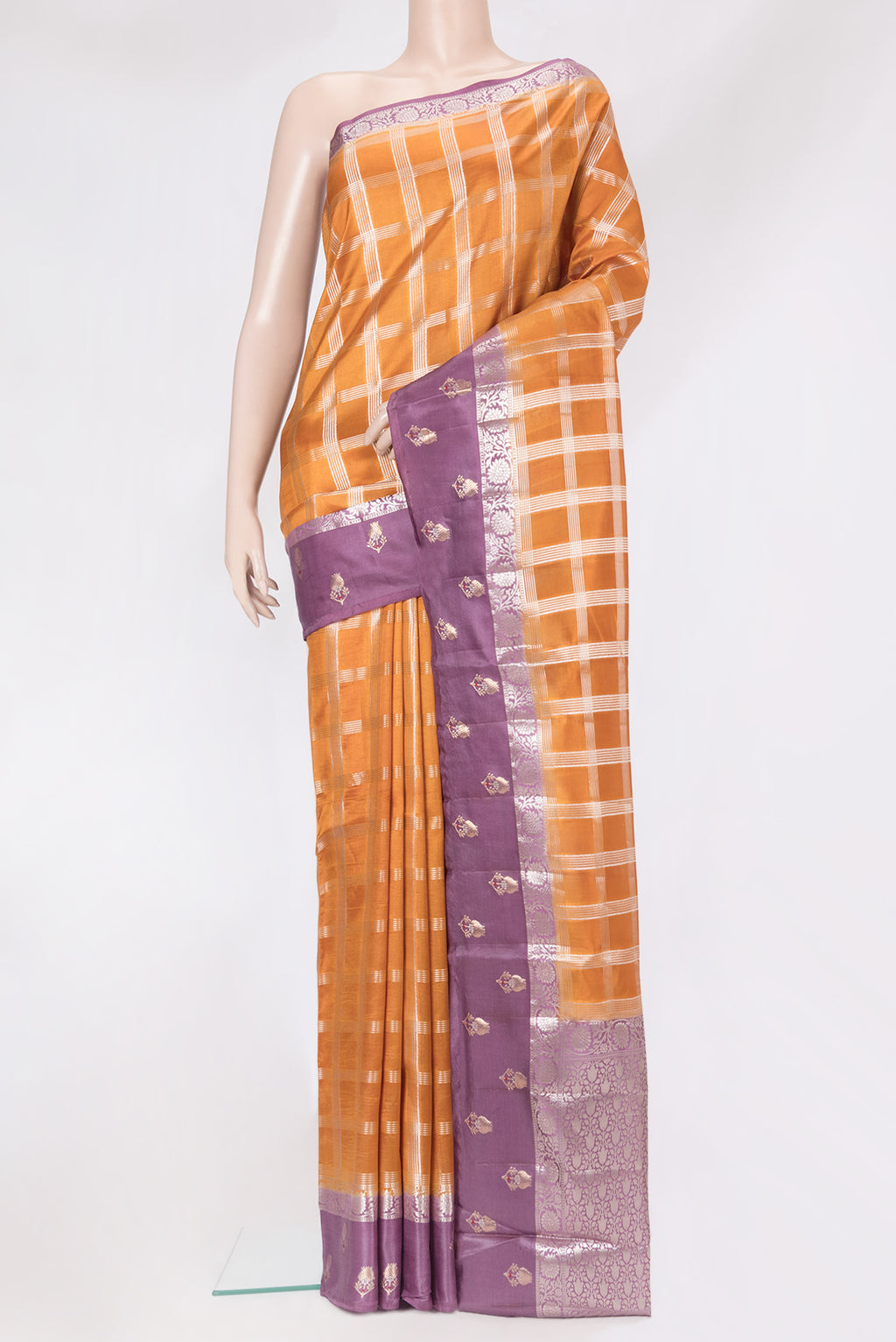 Brick Orange Dual Tone Tussar Silk Saree with Checked design on the body and Fancy Border.  displayed on a mannequin