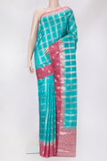 Sky Blue Dual Tone Tussar Silk Saree with Checked design on the body and Fancy Border.  displayed on a mannequin