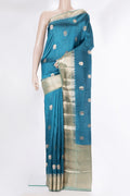 Pure Silk Peacock Blue Dual Tone Tussar Saree with Zari Butta on the body and Fancy Border.  displayed on a mannequin