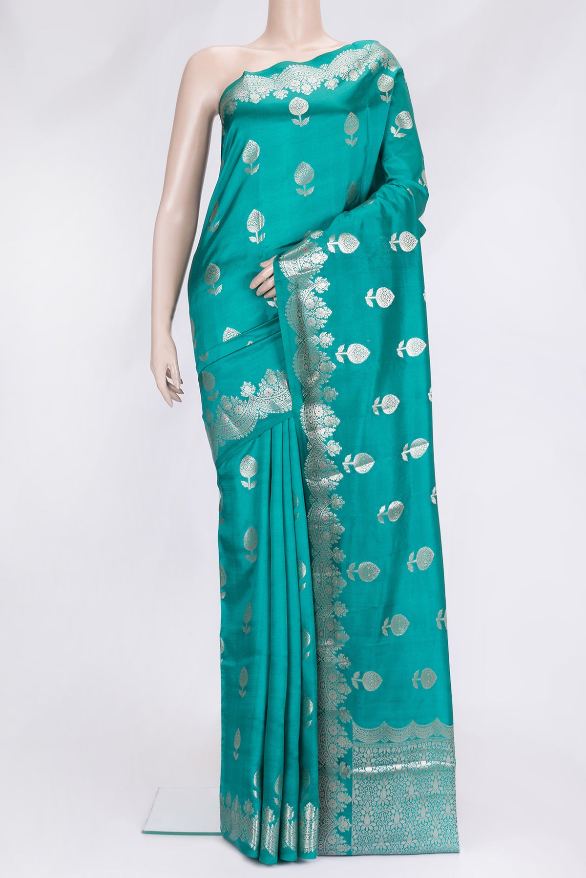 Sea Green Dual Tone Tussar Silk Saree with Zari Butta on the body and Fancy Border.  displayed on a mannequin