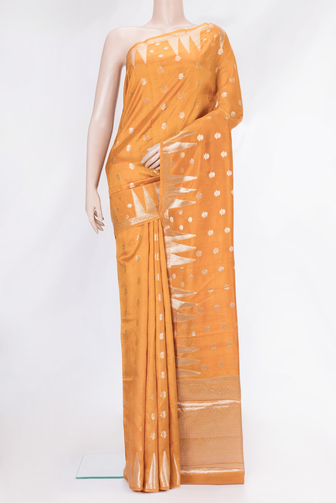 Gold Dual Tone Banarasi Raw Silk Saree with Zari Butta on the body and Fancy Border.  displayed on a mannequin