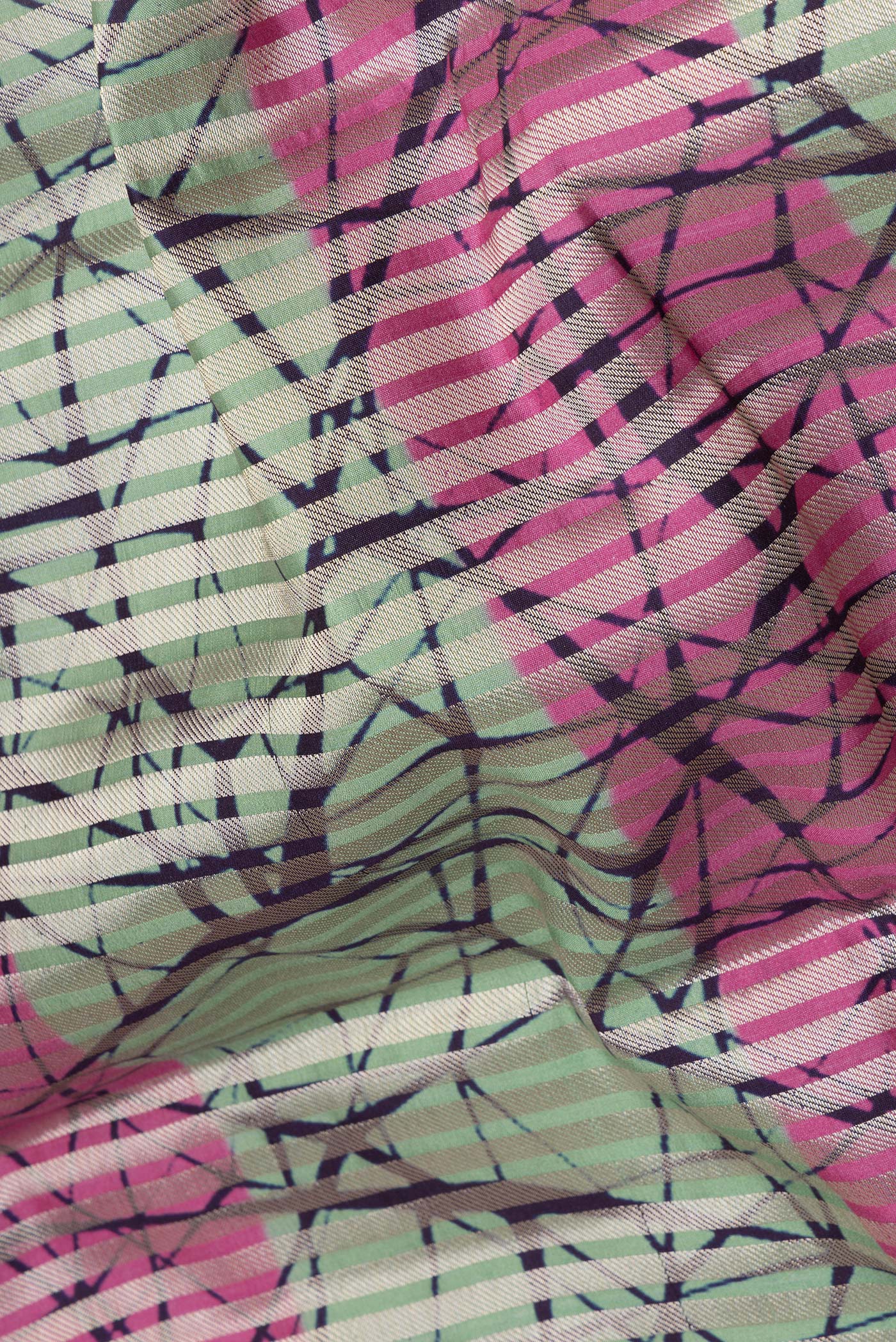 Close up of Multi Color Tussar Silk Saree with Stripes on the body and Without Border.  displaying folds