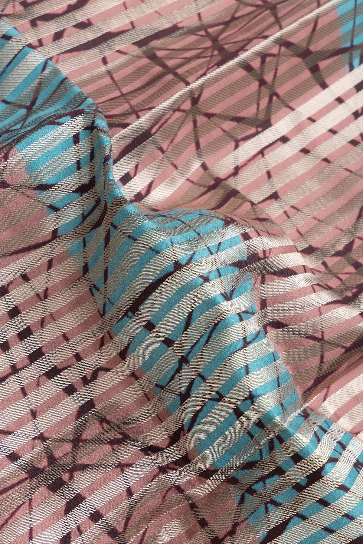 Close up of Sky Blue and Peach Color Tussar Silk Saree with Stripes on the body and Thin Zari Line.  displaying folds