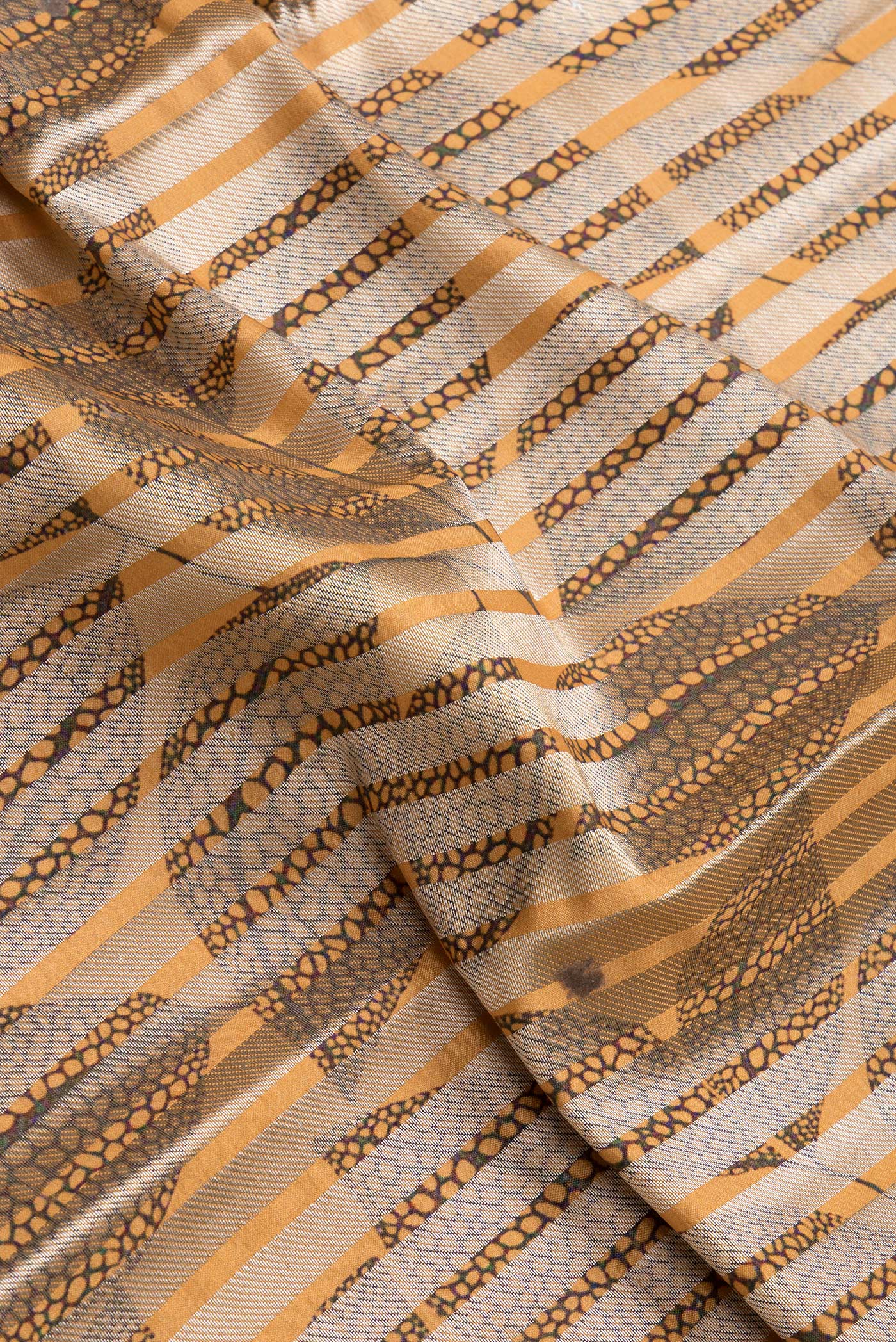 Close up of Sandal Dual Tone Tussar Silk Saree with Stripes on the body and Thin Zari Line.  displaying folds