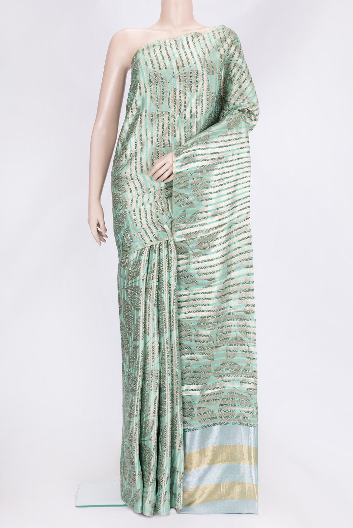 Sea Green Dual Tone Tussar Silk Saree with Stripes on the body and Without Border.  displayed on a mannequin