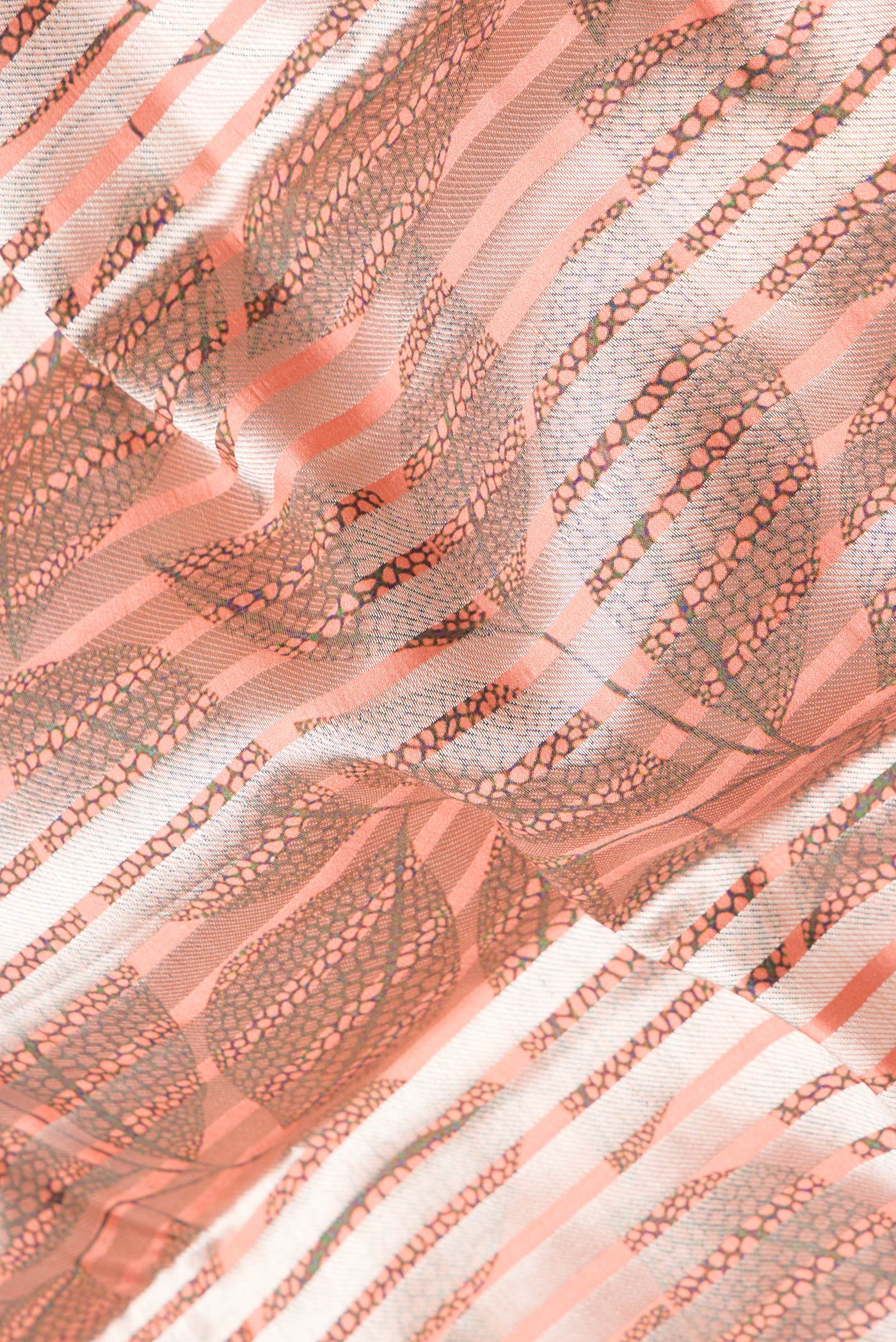 Close up of Peach Dual Tone Tussar Silk Saree with Stripes on the body and Without Border.  displaying folds