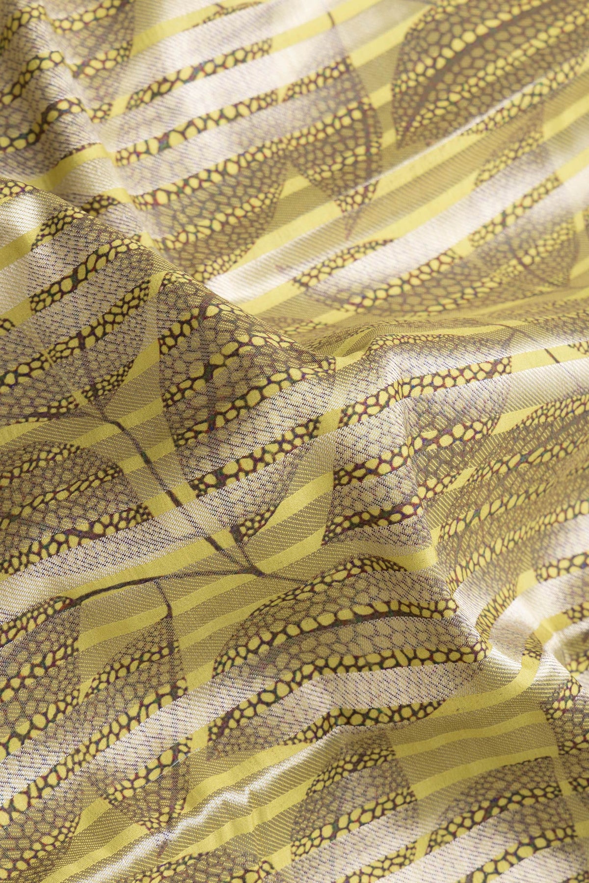 Close up of Pista Green Dual Tone Tussar Silk Saree with Stripes on the body and Thin Zari Line.  displaying folds