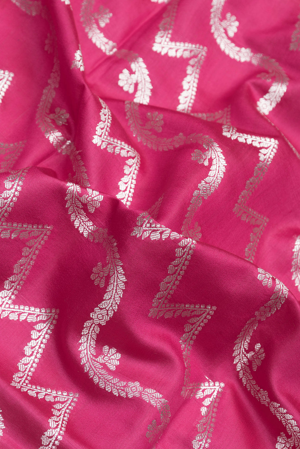 Close up of Pink Dual Tone Tussar Silk Saree with Zari Brocade on the body and Zari Border.  displaying folds