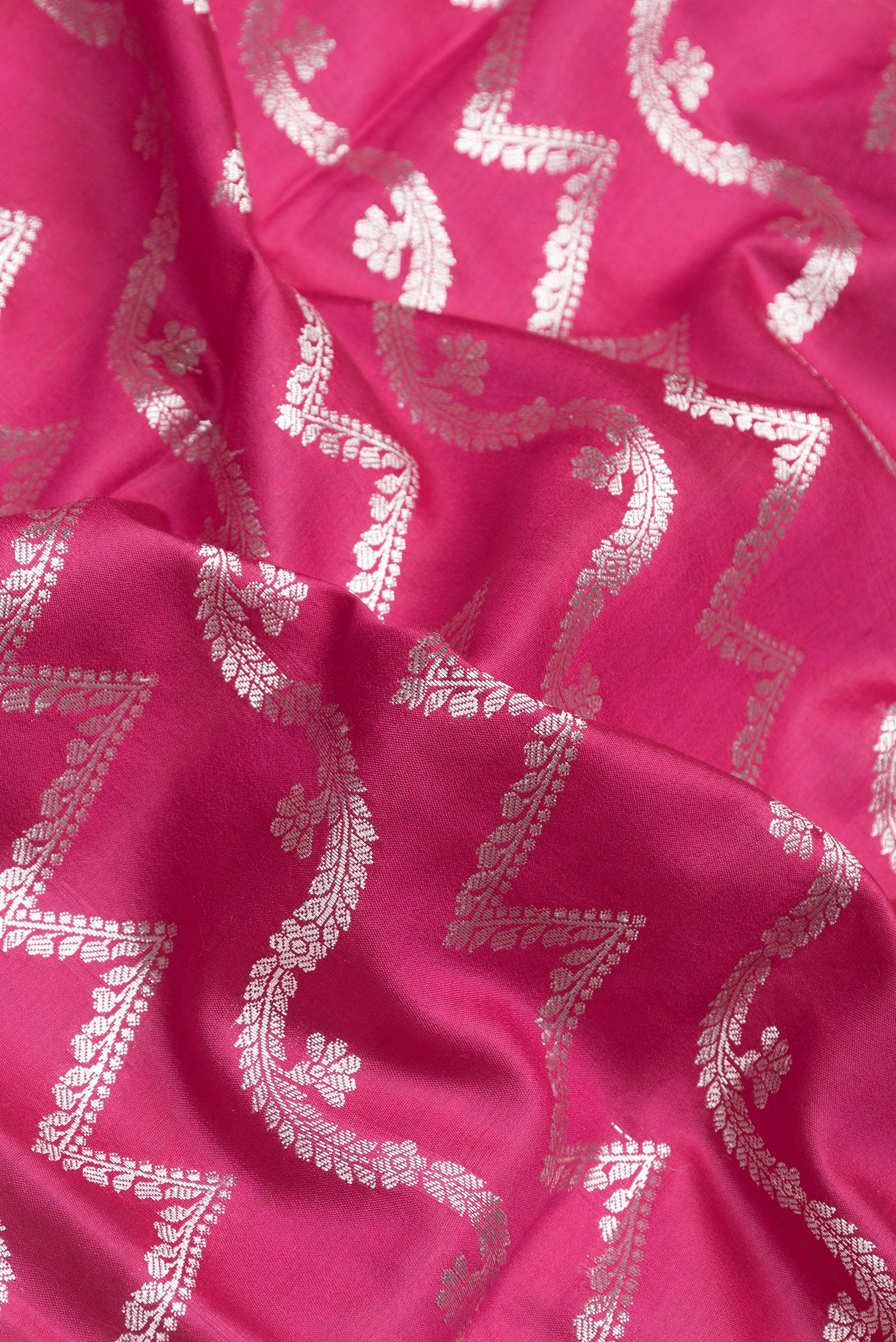 Close up of Pink Dual Tone Tussar Silk Saree with Zari Brocade on the body and Zari Border.  displaying folds
