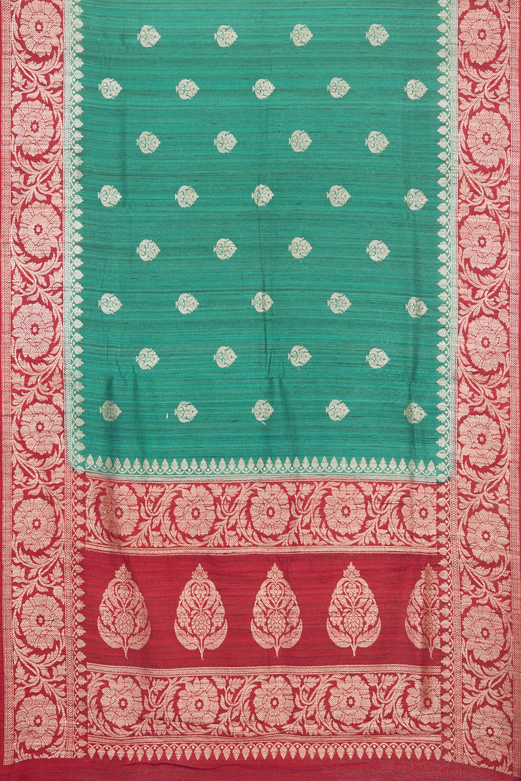 Flat view of Green Tussar Saree with Zari Butta on the body and Fancy Border. 