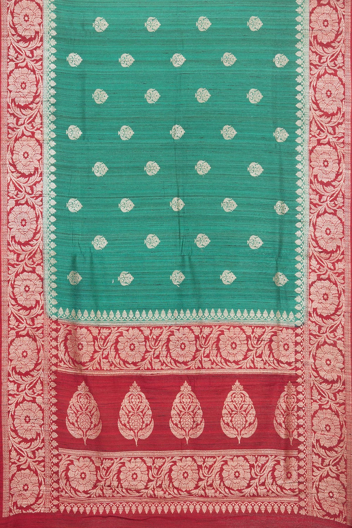 Flat view of Green Tussar Saree with Zari Butta on the body and Fancy Border. 