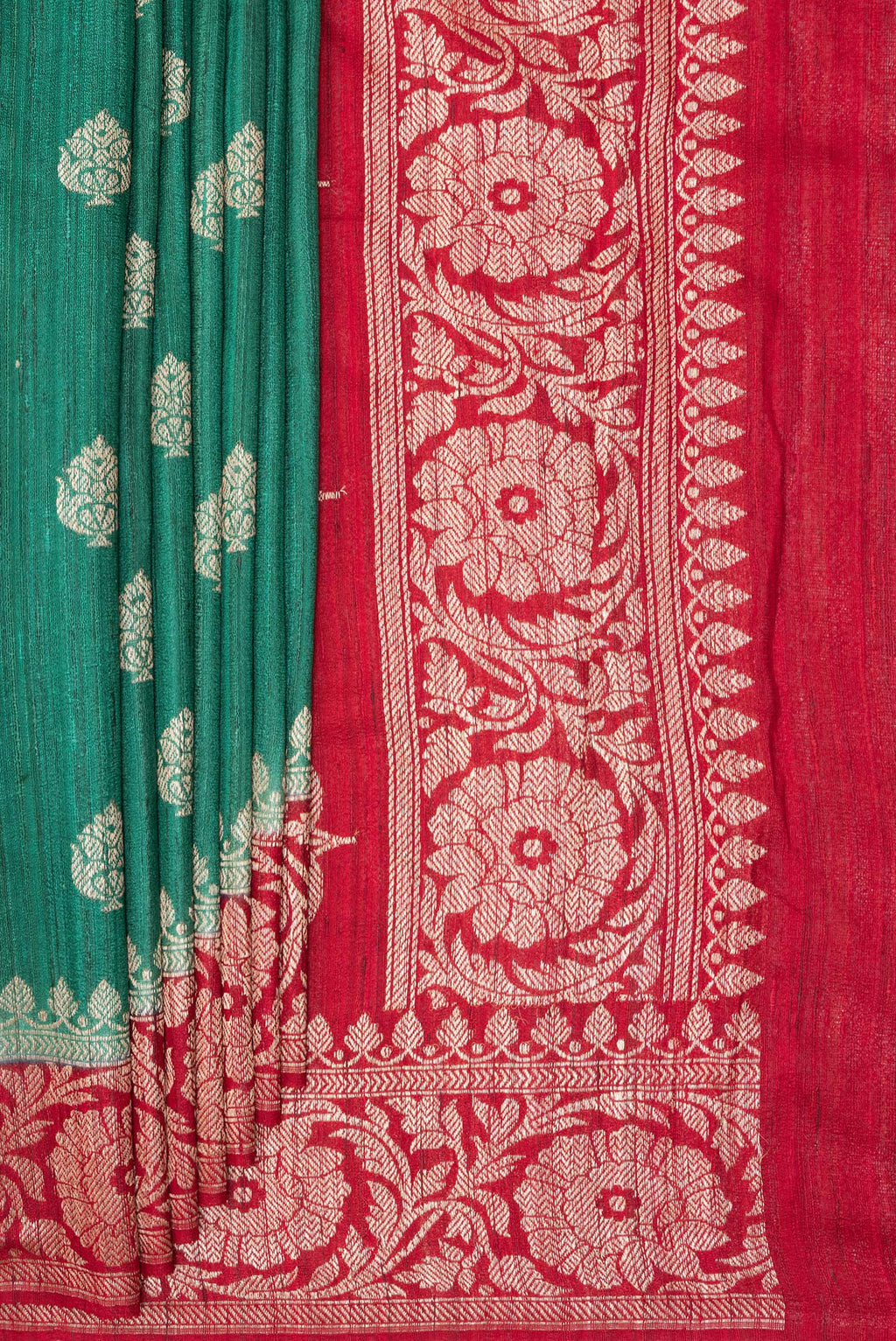 Pleats and pallu of Green Tussar Saree with Zari Butta on the body and Fancy Border. 