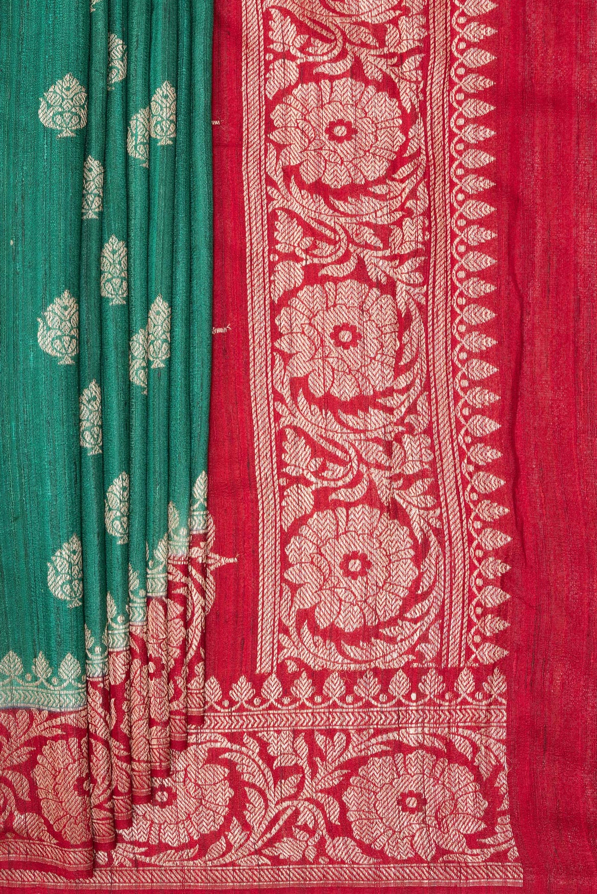 Pleats and pallu of Green Tussar Saree with Zari Butta on the body and Fancy Border. 