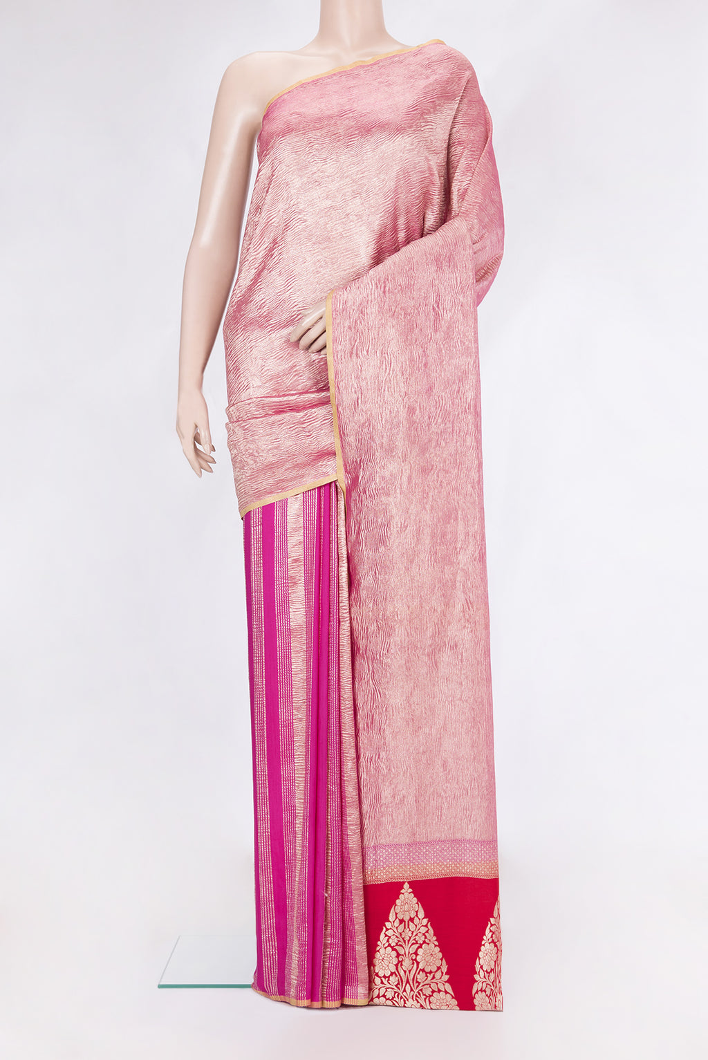 Rani Pink Tussar Silk Saree with Stripes on the body and Zari Border.  displayed on a mannequin